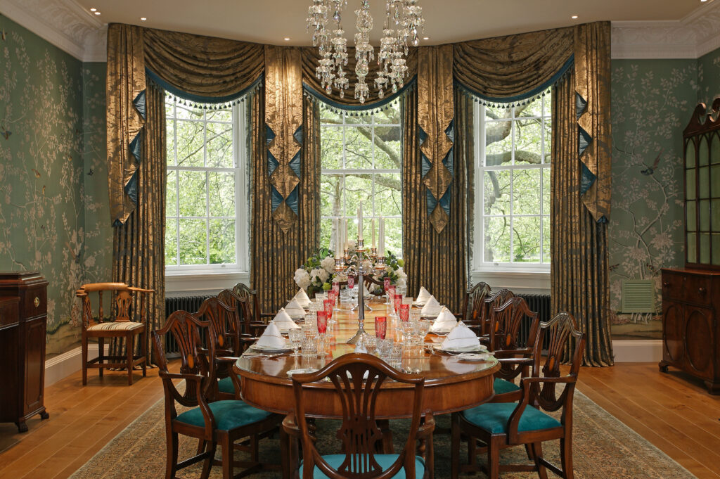 a formal dining room with a chandelier